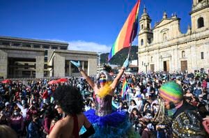 Member's of the LGBTIQ community take part in the Pride Parade at Bolivar square in Bogota, on July 4, 2021. (Photo by Juan BARRETO / AFP)