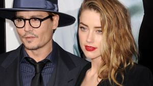 HOLLYWOOD, CA- FEBRUARY 12: Actors Johnny Depp (L) and Amber Heard arrive at the Los Angeles premiere of '3 Days To Kill' at ArcLight Cinemas on February 12, 2014 in Hollywood, California.(Photo by Jeffrey Mayer/WireImage)