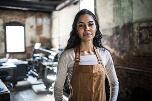 Portrait of female business owner in printing shop