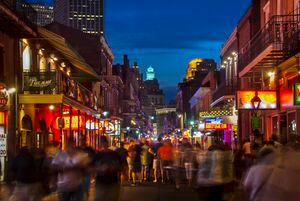 Pedestrian friendly Bourbon Street is lined with clubs and bars in New Orleans, Louisiana.