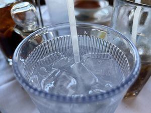Glass of water with compostable straw in a restaurant in Half Moon Bay, California, January 2, 2022. Photo courtesy Sftm. (Photo by Gado/Getty Images)