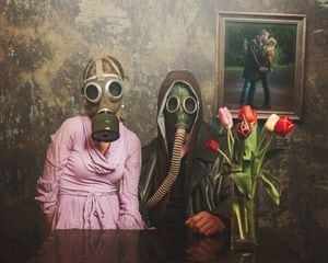 Young couple wearing gas mask / Image on the wall: Stock photo ID:641327870