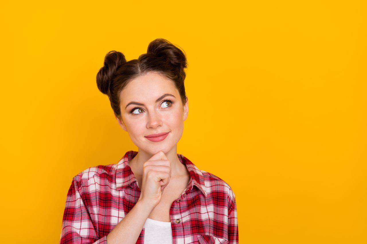 Photo of cute minded person arm chin look interested empty space isolated on yellow color background.