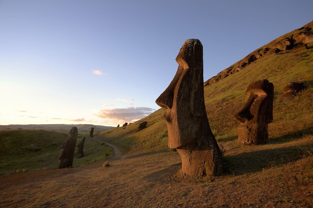 Chile, Easter Island, Moai statues of Rano Raraku at dusk