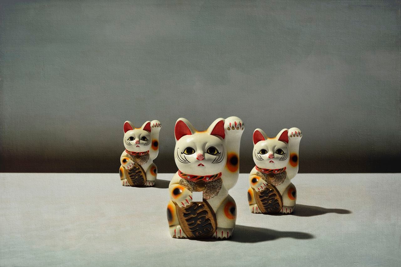 The maneki-neko  which is often believed to bring good luck to the owner.
