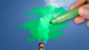 Man painting green pollution from a chimney. greenwashing malpractice concept