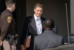 FAIRFAX, VA - MAY 3: (NY & NJ NEWSPAPERS OUT) Amber Heard departs following a recess for the day outside court during the Johnny Depp and Amber Heard civil trial at Fairfax County Circuit Court on May 3, 2022 in Fairfax, Virginia. Depp is seeking $50 million in alleged damages to his career over an op-ed Heard wrote in the Washington Post in 2018.(Photo by Ron Sachs/Consolidated News Pictures/Getty Images)