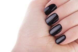 Very beautiful black nails close up.