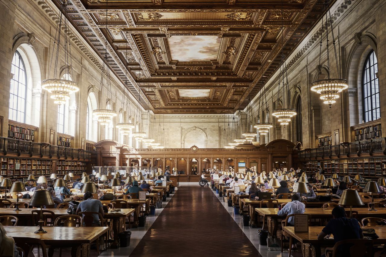 People reading at the New York Public Library