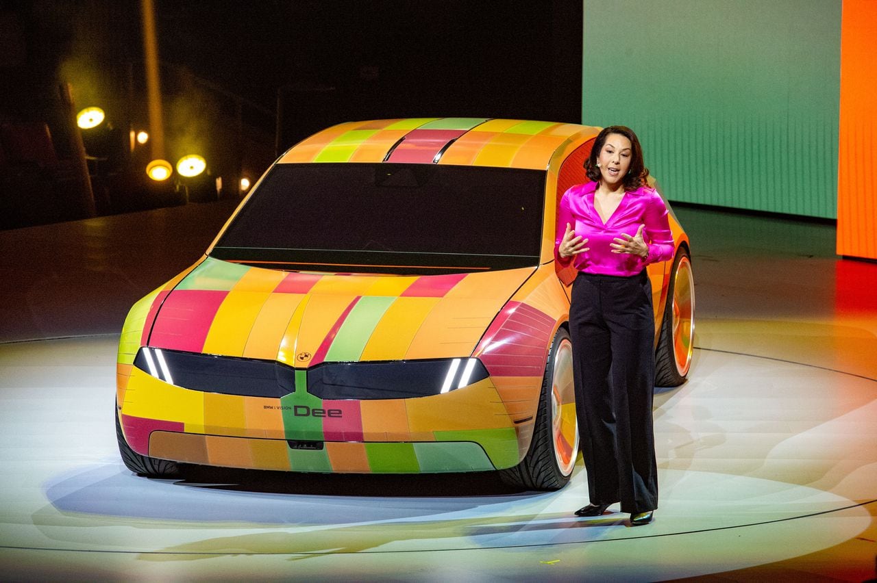 04 January 2023, US, Las Vegas: BMW manager Stella Clarke is demonstrating technology at the CES technology trade show that allows a car to change color. To do this, the car body is covered with e-ink cells. Photo: Andrej Sokolow/dpa (Photo by Andrej Sokolow/picture alliance via Getty Images)