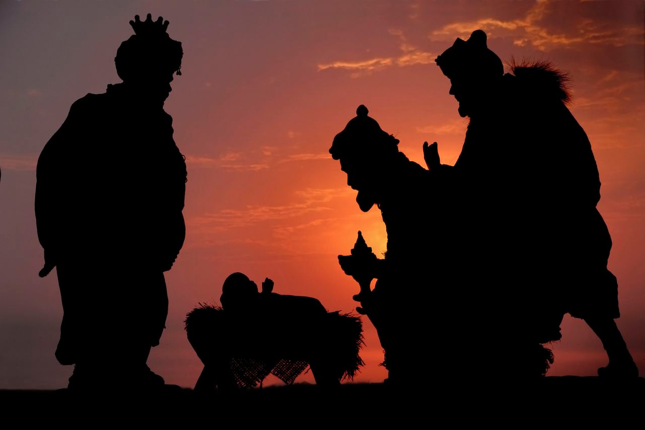 A photographed Silhouette of the Three Kings and Jesus against a sunset sky.  (not an illustration).PLEASE CLICK ON THE IMAGE BELOW TO SEE MY LIGHTBOX CONTAINING ALL OF MY SILHOUETTE IMAGES: