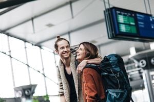 Young backpacker couple at airport