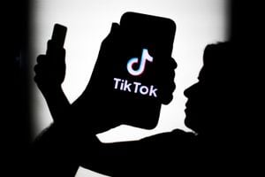 TikTok logo displayed on a phone screen is seen in this illustration photo taken in Krakow, Poland on July 18, 2021.  (Photo Ilustration by Jakub Porzycki/NurPhoto via Getty Images)