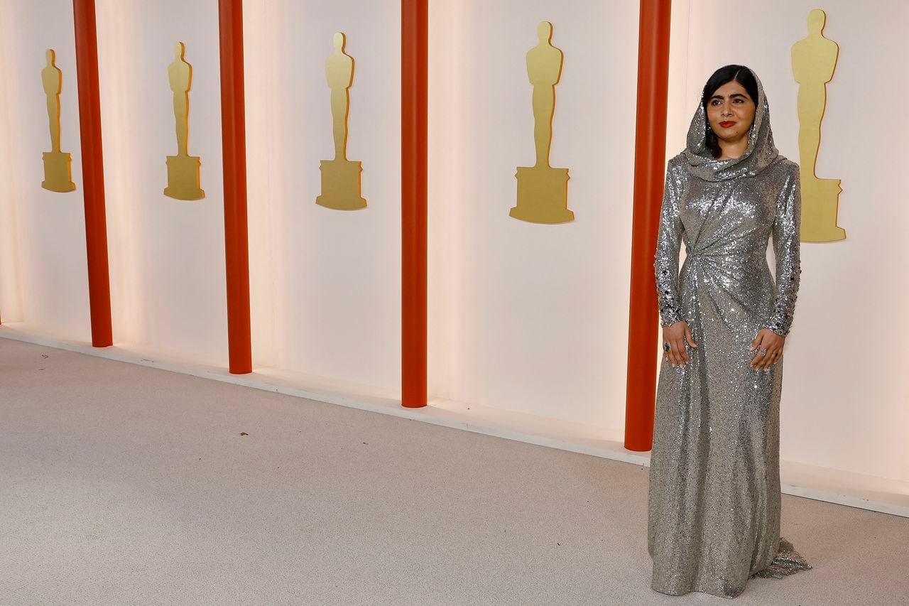 Malala Yousafzai poses on the champagne-colored red carpet during the Oscars arrivals at the 95th Academy Awards in Hollywood, Los Angeles, California, U.S., March 12, 2023. REUTERS/Aude Guerrucci