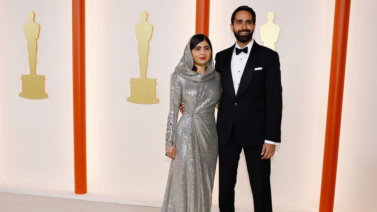 Malala Yousafzai poses on the champagne-colored red carpet during the Oscars arrivals at the 95th Academy Awards in Hollywood, Los Angeles, California, U.S., March 12, 2023. REUTERS/Eric Gaillard