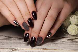 Amazing natural nails. Women's hands with clean manicure. Gel polish applied.