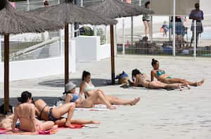 MADRID, SPAIN - MAY 14: Several people sunbathe at the Casa de Campo municipal swimming pool on May 14, 2022, in Madrid, Spain. Today, May 14, the municipal swimming pools of the Community of Madrid open, with free access as it is the first day of opening, and will remain open until September 12. As last year, two shifts of use are maintained, closing at noon from 14.30 to 16.30 hours, to disinfect and clean the facilities, a measure that was adopted for the first time in the sports facilities last year due to the pandemic. (Photo By Gustavo Valiente/Europa Press via Getty Images)