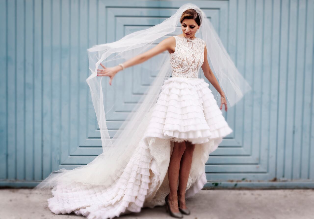 A bride holding out her veil