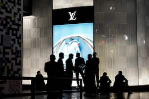 WUHAN, CHINA - OCTOBER 30: (CHINA OUT) The security rest after new Louis Vuitton traveling exhibition "SEE LV" Opening ceremony at Wuhan International Plaza on October 30, 2020 in Wuhan, Hubei province, China. Wuhan is the first stop of the global tour. As there have been no recorded cases of Covid-19 community transmissions since May, life for residents is gradually returning to normal. (Photo by Getty Images)