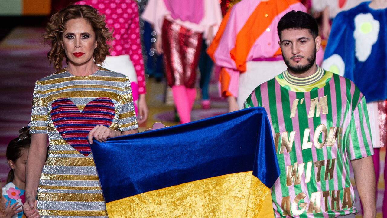 MADRID, SPAIN - MARCH 10: (EDITORIAL USE ONLY) Designer Agatha Ruiz de la Prada and singer Omar Montes walk the runway at the Agatha Ruiz De La Prada fashion show during Mercedes Benz Fashion Week Madrid March 2022 edition at Ifema on March 10, 2022 in Madrid, Spain. (Photo by Pablo Cuadra/WireImage)