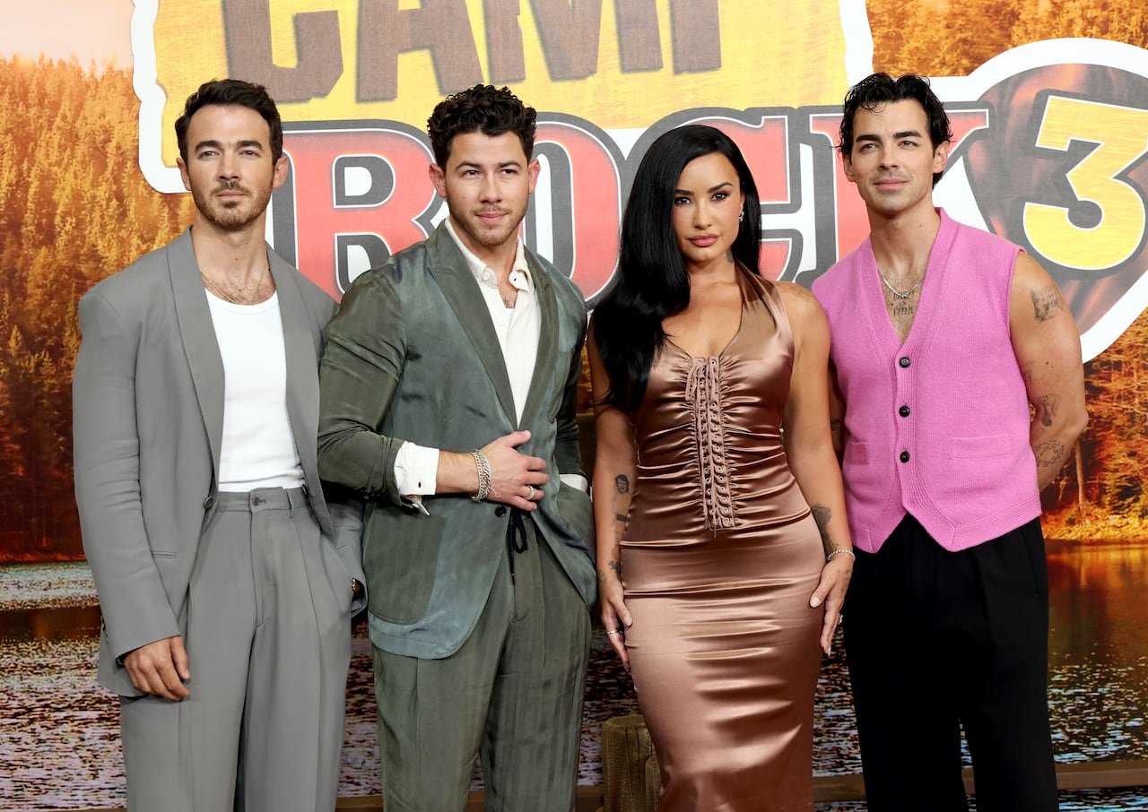 BURBANK, CALIFORNIA - AUGUST 10: (L-R) Kevin Jonas, Nick Jonas, Demi Lovato and Joe Jonas attend the Los Angeles premiere of Disney's "Camp Rock 3" at Walt Disney Studios on August 10, 2026 in Burbank, California. (Photo by Monica Schipper/Getty Images)