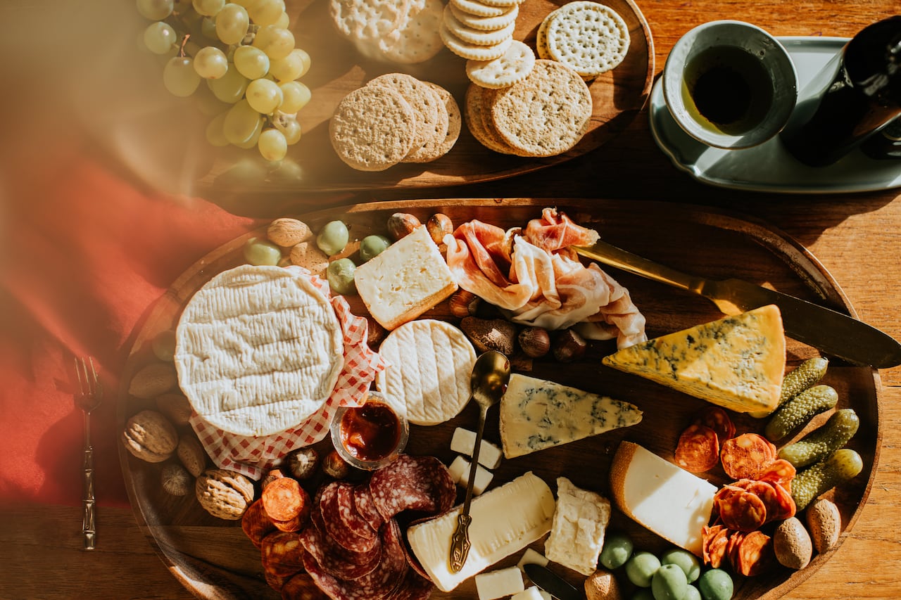 Top down image of a beautiful cheese and charcuterie board with space for copy