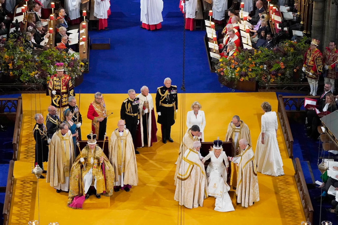 LONDON, ENGLAND - MAY 06:  King Charles III and Queen Camilla after being crowned during their coronation ceremony in Westminster Abbey, on May 6, 2023 in London, England. The Coronation of Charles III and his wife, Camilla, as King and Queen of the United Kingdom of Great Britain and Northern Ireland, and the other Commonwealth realms takes place at Westminster Abbey today. Charles acceded to the throne on 8 September 2022, upon the death of his mother, Elizabeth II. (Photo by Andrew Matthews - WPA Pool/Getty Images)