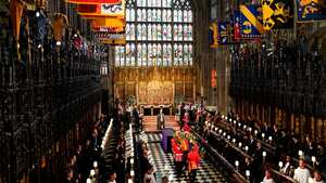 Pallbearers carry the coffin of Britain's Queen Elizabeth II in to St George's Chapel for a committal service at Windsor Castle, in Windsor, England, Monday, Sept. 19, 2022. (Joe Giddens/Pool Photo via AP)