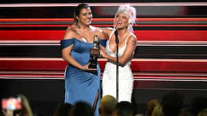 CORAL GABLES, FLORIDA - OCTOBER 05: Valentina Bueno and Karol G speak onstage during the 2023 Billboard Latin Music Awards at Watsco Center on October 05, 2023 in Coral Gables, Florida. (Photo by Jason Koerner/Getty Images)