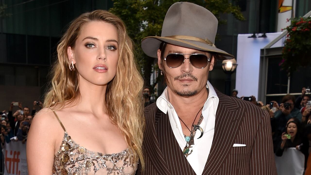 TORONTO, ON - SEPTEMBER 12: Actors Amber Heard (L) and Johnny Depp attend "The Danish Girl" premiere during the 2015 Toronto International Film Festival at the Princess of Wales Theatre on September 12, 2015 in Toronto, Canada. (Photo by Jason Merritt/Getty Images)