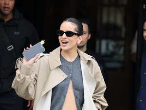 PARIS, FRANCE - SEPTEMBER 26: Rosalía greets fans as she leave The Ritz Hotel during the Womenswear Spring/Summer 2025 as part of Paris Fashion Week on September 26, 2024 in Paris, France. (Photo by Neil Mockford/GC Images)