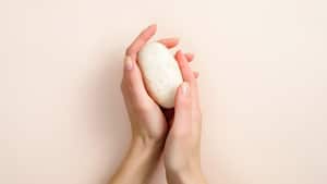 Female hands holding natural organic soap. Healthy lifestyle, beauty, skin care. Zero waste, plastic free bathroom and home concept.