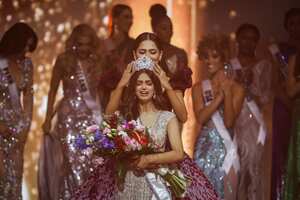 13 December 2021, Israel, Eilat: Miss India Harnaaz Sandhu reacts as she is crowned as Miss Universe during the 70th Miss Universe beauty pageant in Israel's southern Red Sea coastal city of Eilat. Photo: Ilia Yefimovich/dpa (Photo by Ilia Yefimovich/picture alliance via Getty Images)