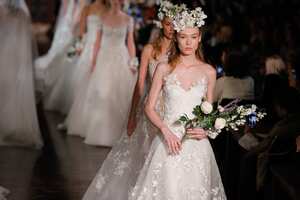 NEW YORK, NY - APRIL 12: A model walks the runway wearing Reem Acra Spring 2019 Bridal Collection with hair by Brian Buenaventura and makeup by Cassandra Garcia at the New York Public Library on April 12, 2018 in New York City. (Photo by Thomas Concordia/Getty Images)