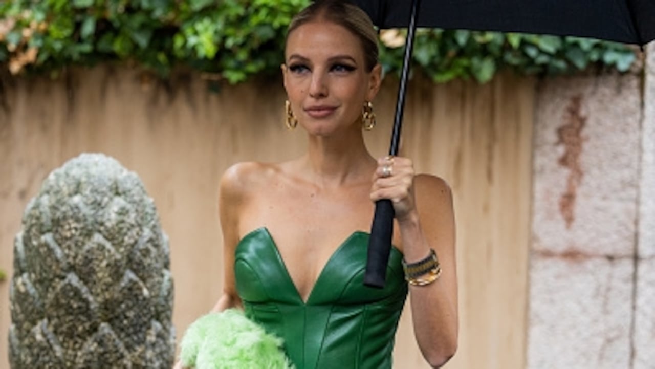 MILAN, ITALY - SEPTEMBER 24: Leonie Hanne wears green off shoulder dress, faux fur bag, green heels outside Ermanno Scervino during the Milan Fashion Week - Womenswear Spring/Summer 2023 on September 24, 2022 in Milan, Italy. (Photo by Christian Vierig/Getty Images)