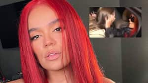 Karol G consolando a una fan.