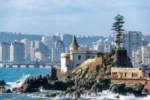 View of Wulff Castle with apartment buildings in the background in Vina del Mar, Chile
