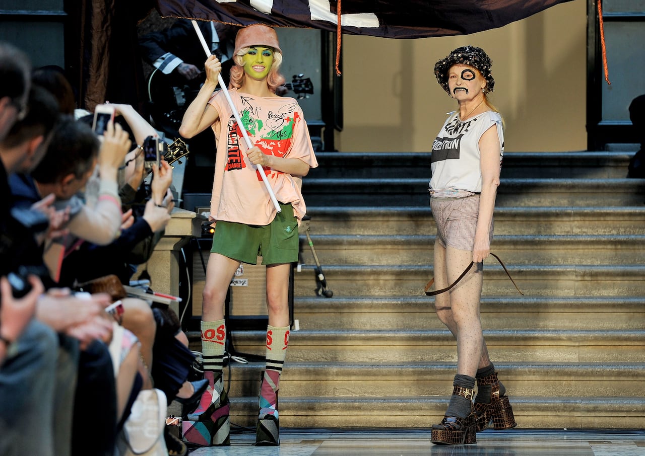 LONDON, ENGLAND - SEPTEMBER 16:  Designer Vivienne Westwood walks on the catwalk by Vivienne Westwood Red Label on day 3 of London Fashion Week Spring/Summer 2013, at the British Foreign & Commonwealth Office on September 16, 2012 in London, England.  (Photo by Gareth Cattermole/Getty Images)