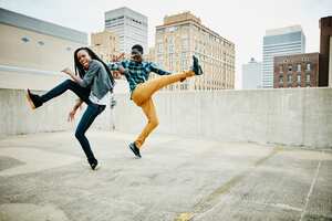 Couple dancing together on rooftop