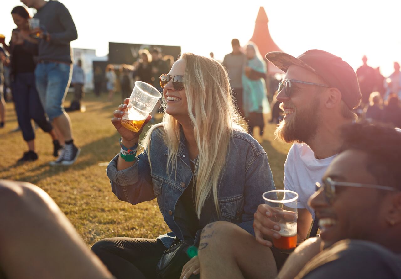 Friends hanging out at big music festival
