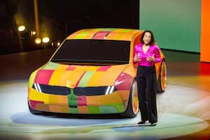 04 January 2023, US, Las Vegas: BMW manager Stella Clarke is demonstrating technology at the CES technology trade show that allows a car to change color. To do this, the car body is covered with e-ink cells. Photo: Andrej Sokolow/dpa (Photo by Andrej Sokolow/picture alliance via Getty Images)