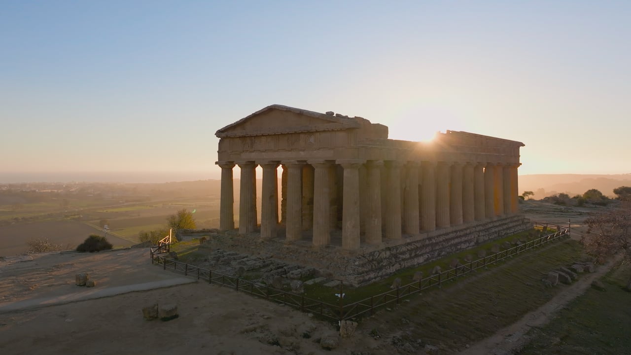 Aerial view of the sun setting behind the Temple of Concord in Agrigentos Valley of Temples. (credit: National Geographic)