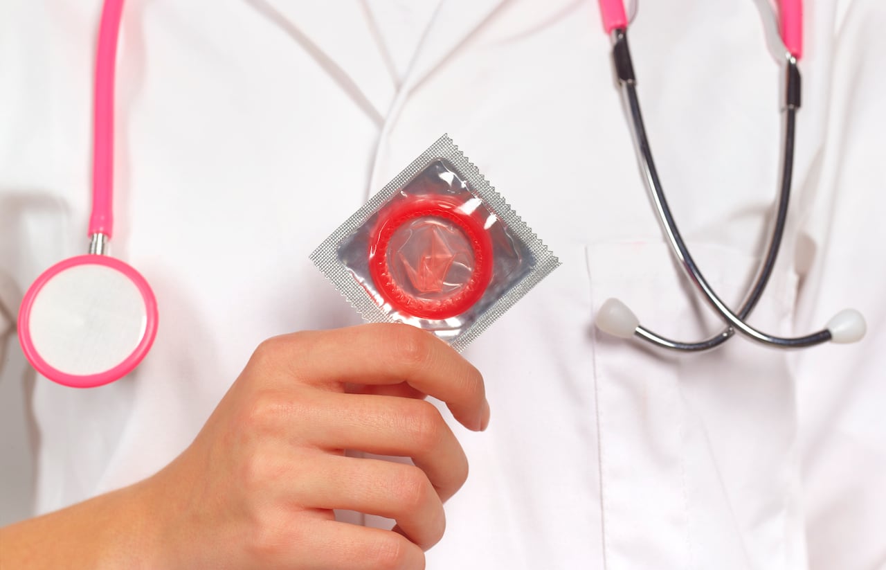 Doctor with condom