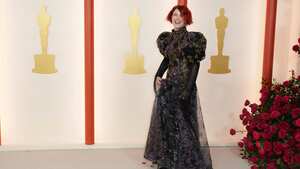 Jessie Buckley arrives at the Oscars on Sunday, March 12, 2023, at the Dolby Theatre in Los Angeles. (Photo by Jordan Strauss/Invision/AP)