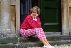 HIGHGROVE, UNITED KINGDOM - JULY 18:  Diana, Princess Of Wales, Sitting On The Steps Outside Her Country Home, Highgrove.  The Princess Is Casually Dressed In Pink Gingham Trousers With A Matching Pink Jumper.  (Photo by Tim Graham Photo Library via Getty Images)