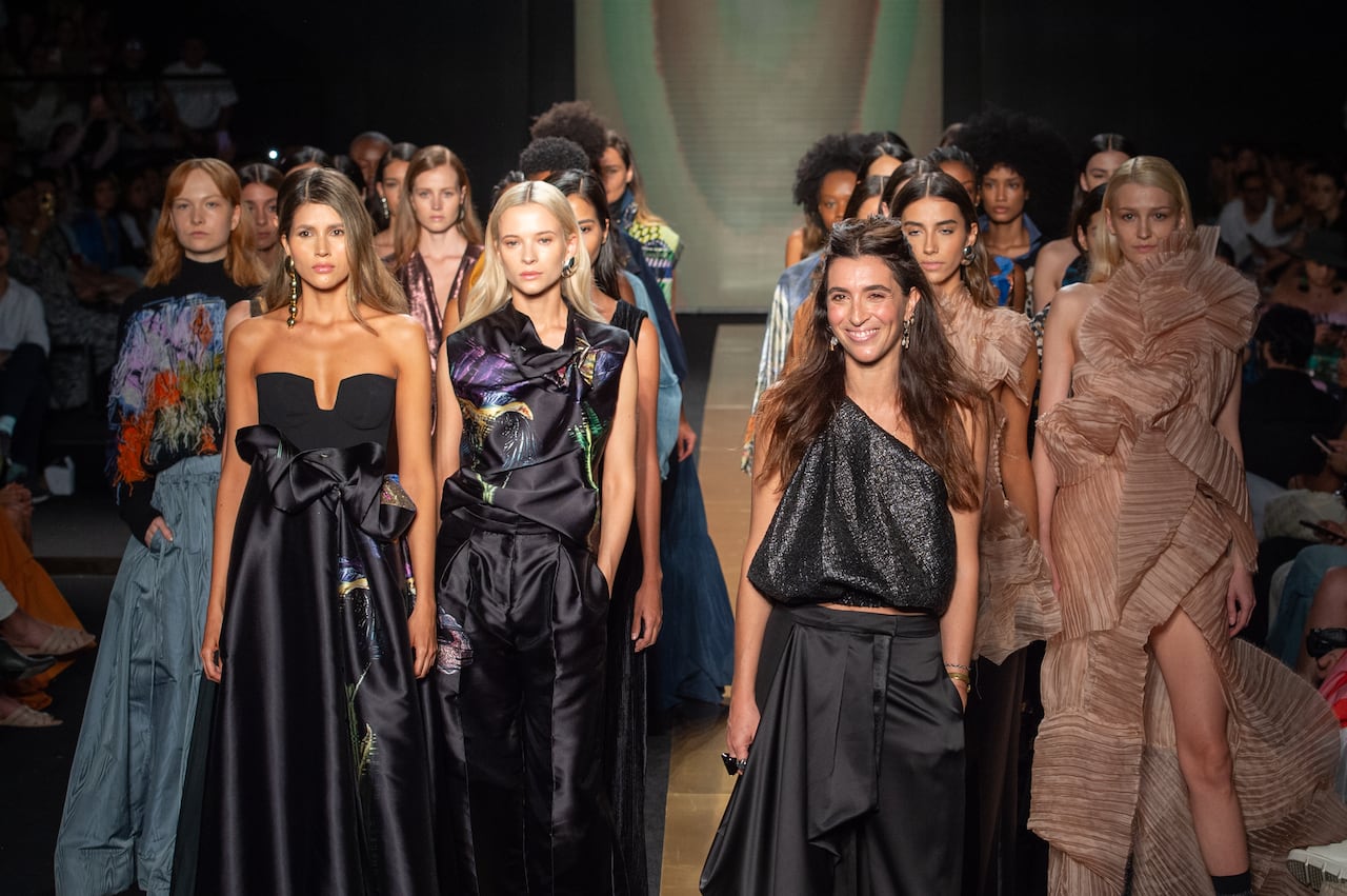 MEDELLIN, COLOMBIA - JULY 25: Sandra Weil and models walk the runway during the KINTSUGI show in collaboration with Inter Rapidísimo y Malva as part of Colombiamoda at Plaza Mayor on July 25, 2024 in Medellin, Colombia.