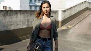 Teenage girl with skateboard