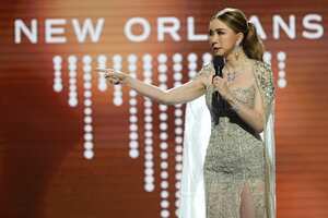 Anne Jakkaphong Jakrajutatip, the new owner of the Miss Universe Organization, speaks onstage to present the ImpactWayv Challenge Award during the final round of the 71st Miss Universe Beauty Pageant in New Orleans, Saturday, Jan. 14, 2023. (AP Photo/Gerald Herbert)