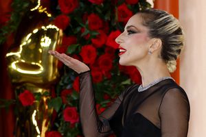 Lady Gaga gestures on the champagne-colored red carpet during the Oscars arrivals at the 95th Academy Awards in Hollywood, Los Angeles, California, U.S., March 12, 2023. REUTERS/Eric Gaillard