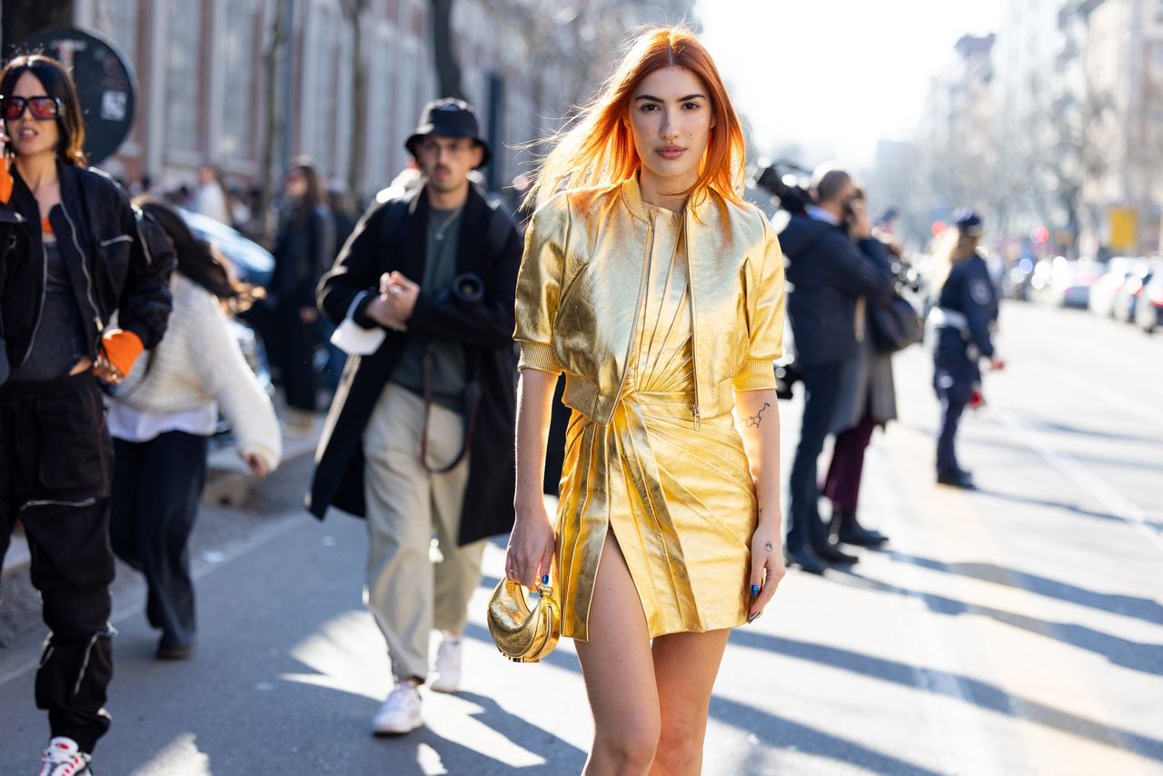 MILAN, ITALY - FEBRUARY 23: Patricia Manfield (Heir) poses ahead of the Fendi fashion show wearing a golden dress and skirt during the Milan Fashion Week Fall/Winter 2022/2023 on February 23, 2022 in Milan, Italy. (Photo by Valentina Frugiuele/Getty Images)